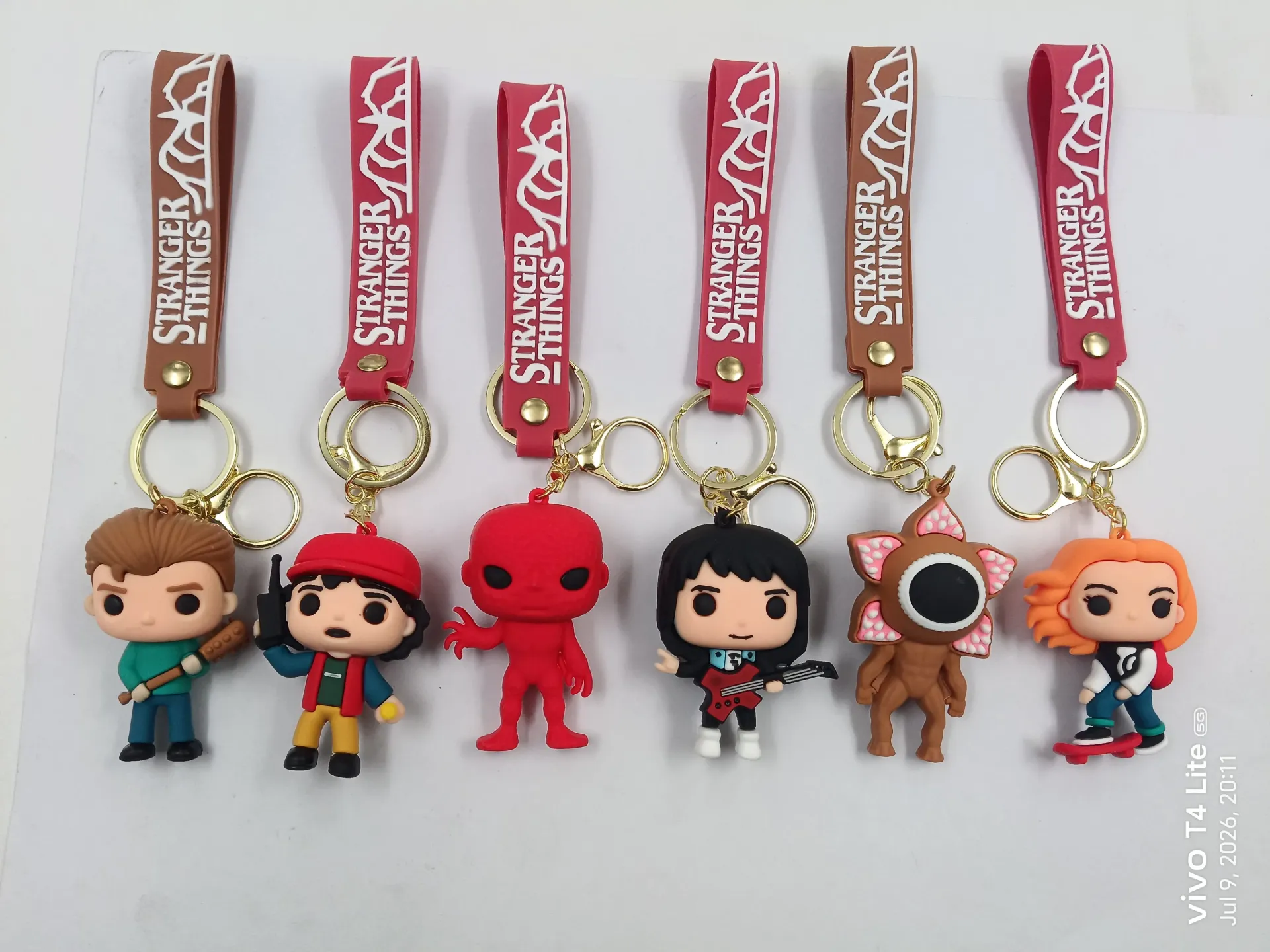 3D Silicon Stranger Things Keychain | Packet Contains 50 pieces of Different types and color of Stranger Things Keychain ( With Packaging ) MOQ - 1 Box ( 50 Pieces )
