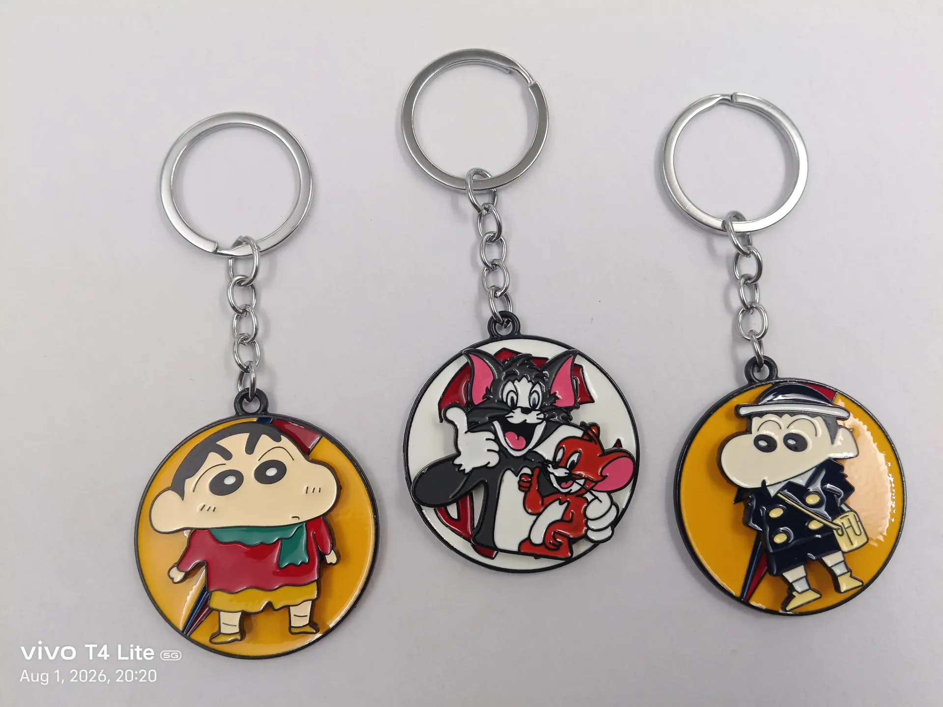 Cartoon Metal Spinning Keychain | Packet Contains 50 pieces of Different types and color of Keychain ( With Packaging ) MOQ - 1 Box ( 50 Pieces )