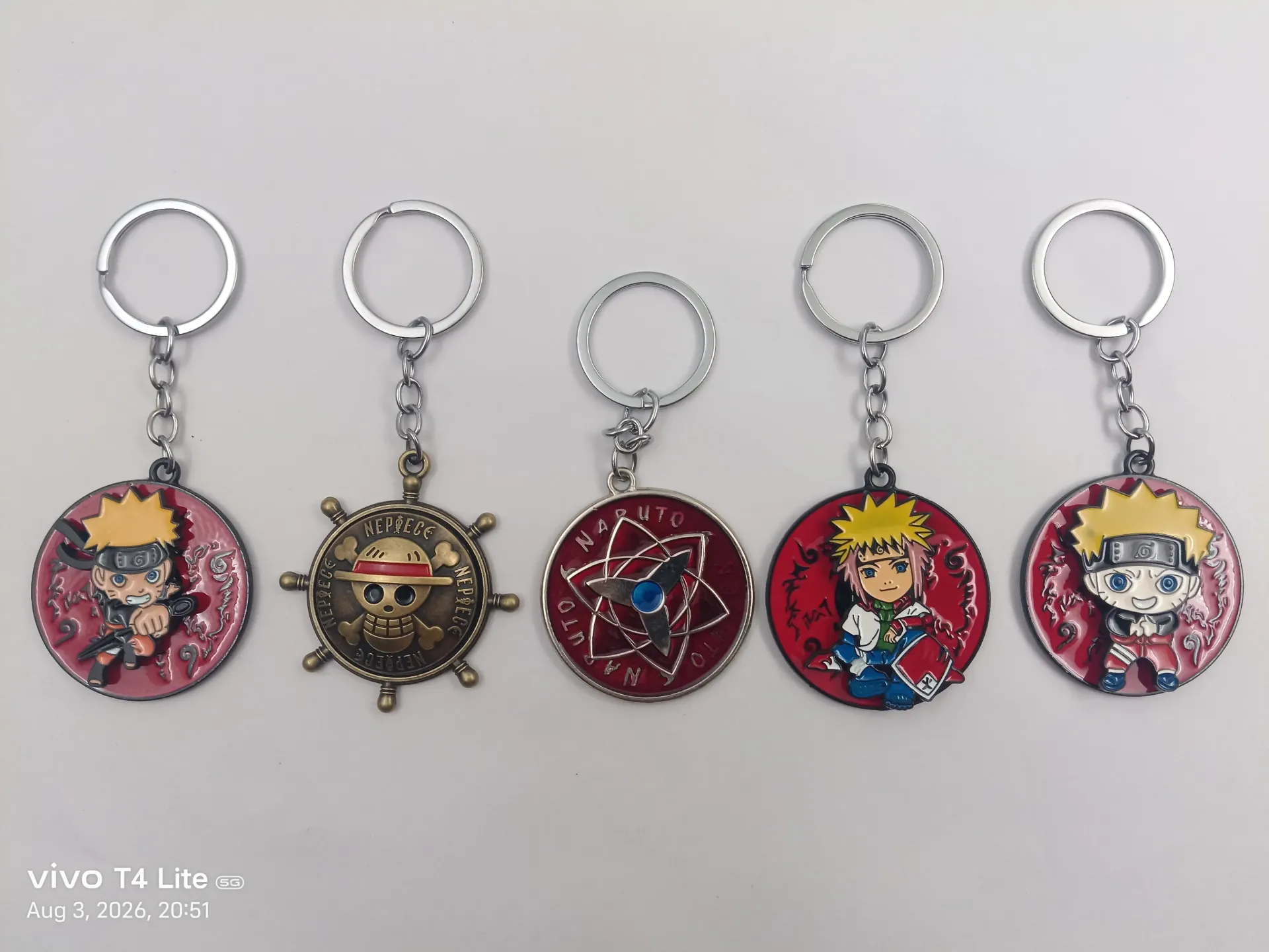 Anime Metal Spinning Keychain | Packet Contains 50 pieces of Different types and color of Keychain ( With Packaging ) MOQ - 1 Box ( 50 Pieces )