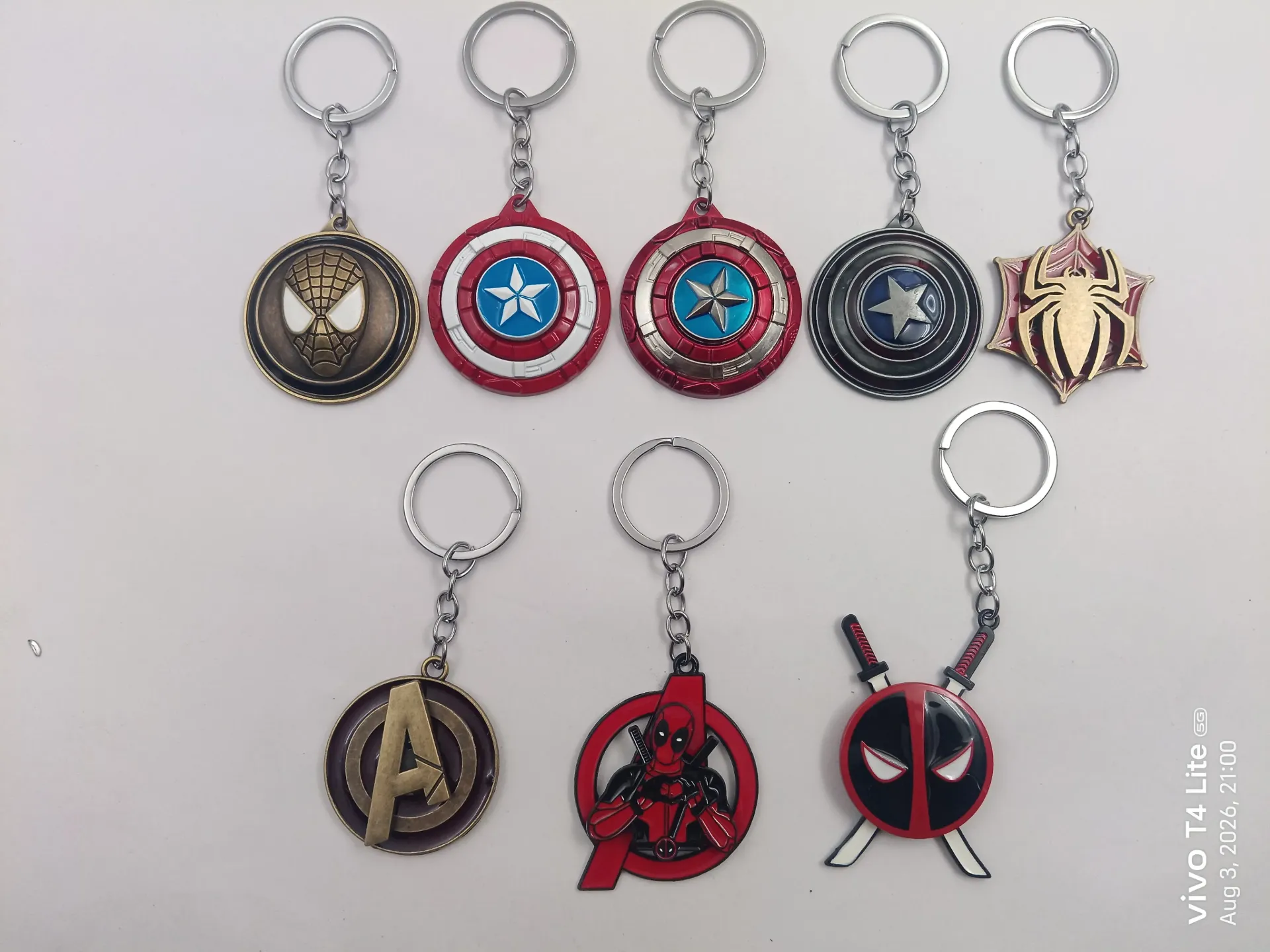 Avengers Metal Spinning Keychain | Packet Contains 50 pieces of Different types and color of Keychain ( With Packaging ) MOQ - 1 Box ( 50 Pieces )